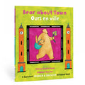 A cover of the book 'Bear about Town / Ours en ville' featuring a illustration of a cartoon bear holding a flower, with buildings in the background. The cover has text in both English and French and mentions that it is a bilingual book.