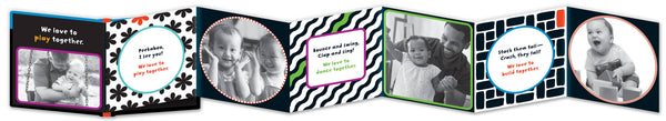 Row of photo albums with various designs and baby photos on a black background
