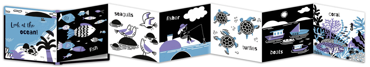 A fold out illustrated children's book shown open side by side, featuring ocean-themed black, white, and blue illustrations such as fish, sea life, a fisherman, turtles, and boats.