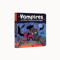 A children's board book titled "Vampires and Other Creatures of the Night" shown standing upright on a plain light background. The cover features a dark illustrated scene with bats, a coffin, spiderwebs, and a blue night sky, plus orange title text and orange bands near the bottom.