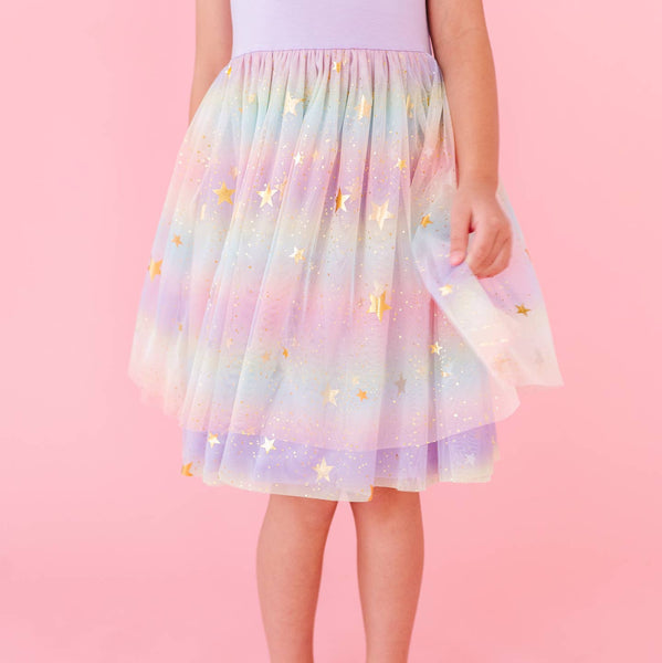 Pastel-colored tulle skirt with star patterns on a pink background