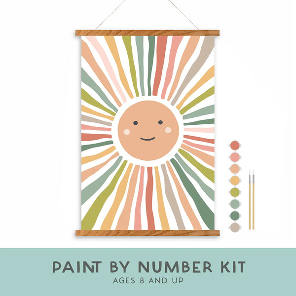 Paint by number kit with a sun design and color swatches on a white background