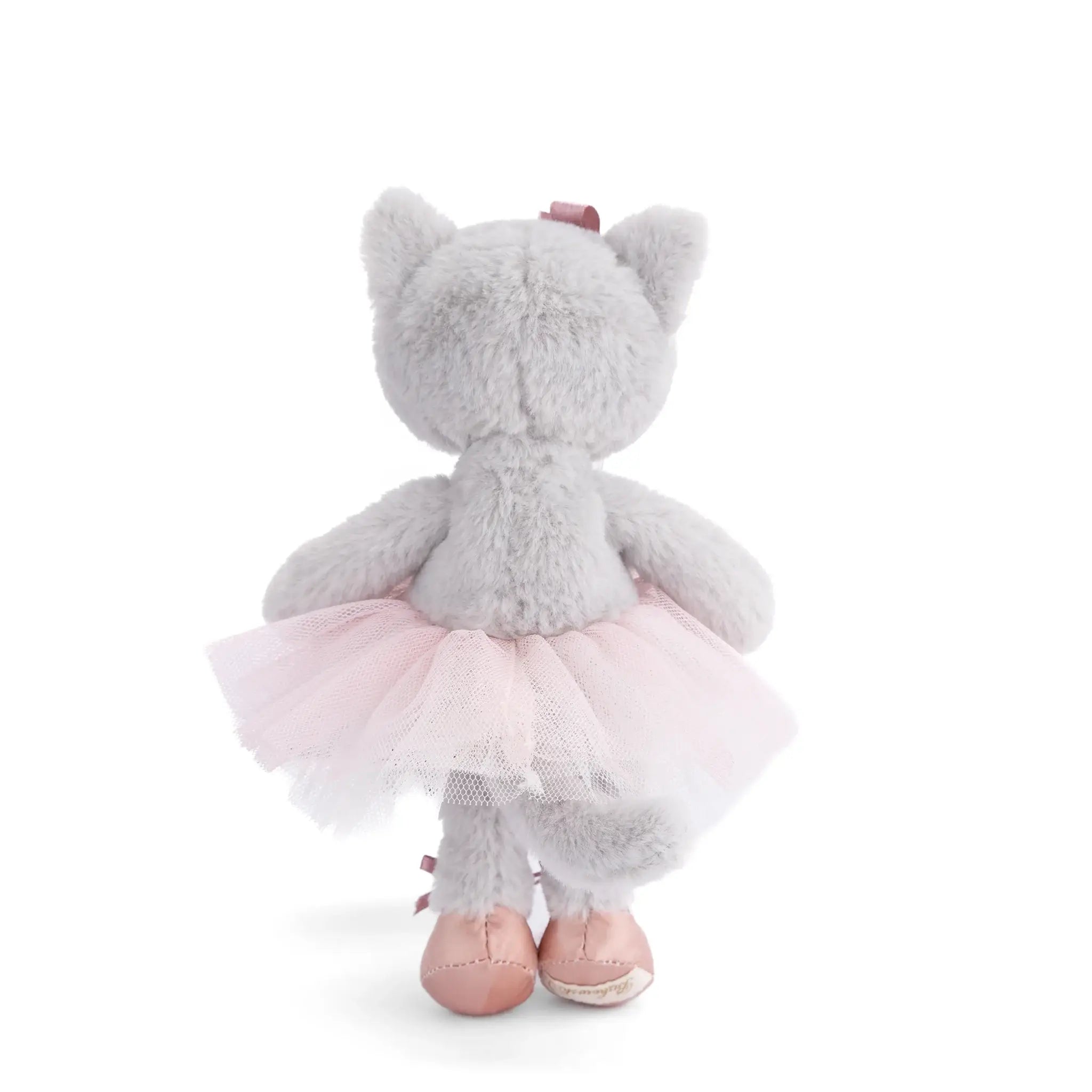 Plush toy cat with a pink tutu on a white background
