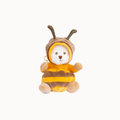 A plush toy shaped like a bear wearing a bee costume, featuring a white face, brown and yellow striped body, and brown antennae, isolated on a light gray background.