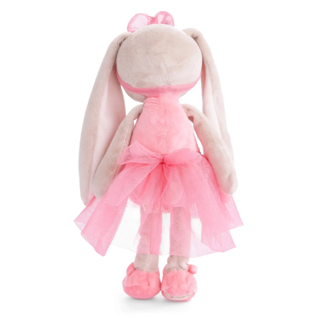 Plush toy rabbit with a pink dress on a white background