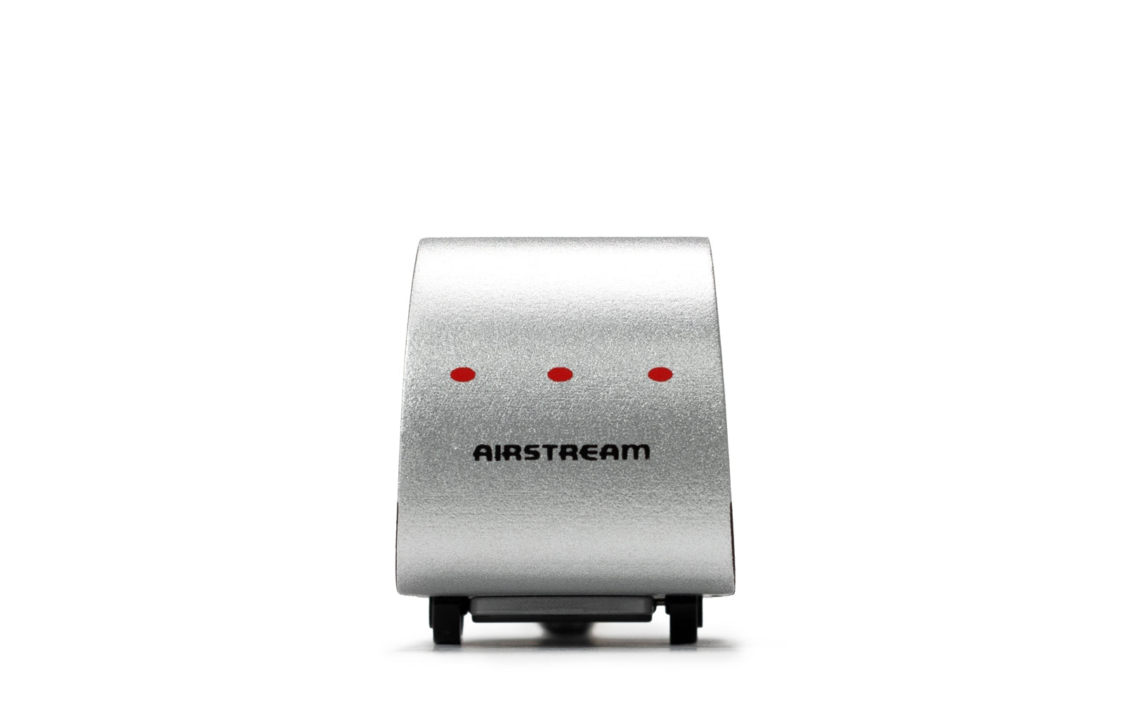 Silver Airstream device with red lights on a white background