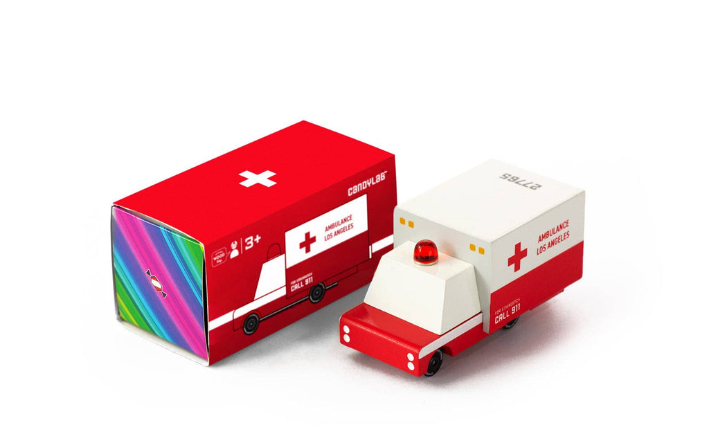 Toy ambulance with colorful packaging on a white background