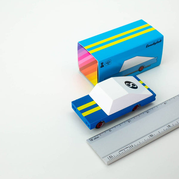 Colorful toy truck with a box on a white background