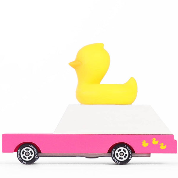 Toy truck with a yellow duck on top against a white background