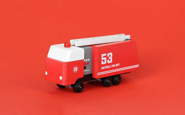 Red toy fire truck with ladder on a red background