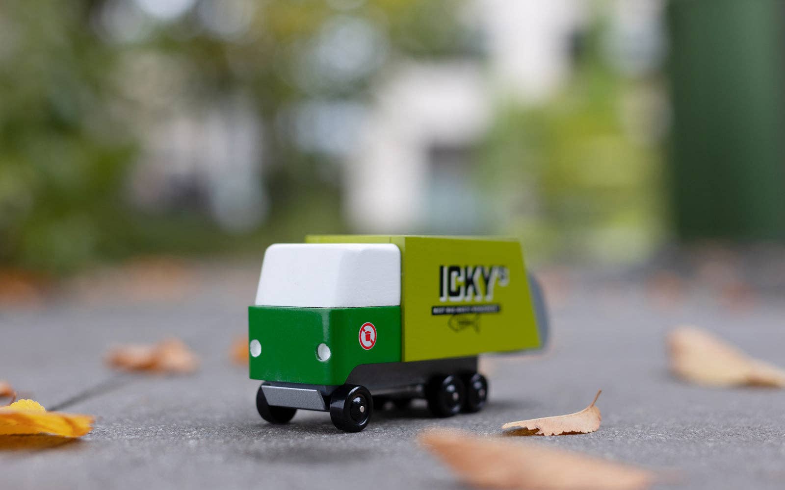 Toy truck with 'ICKY' branding on a blurred outdoor background