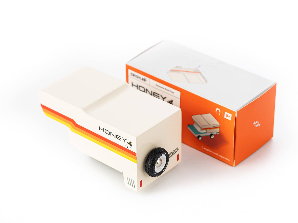 Model of a camper with 'Honey' branding on an orange box