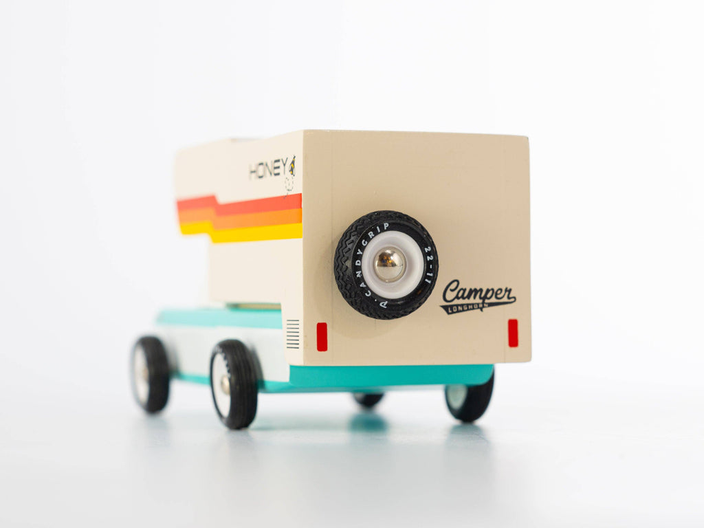 Small model of a camper van with 'Camper' branding on a white background