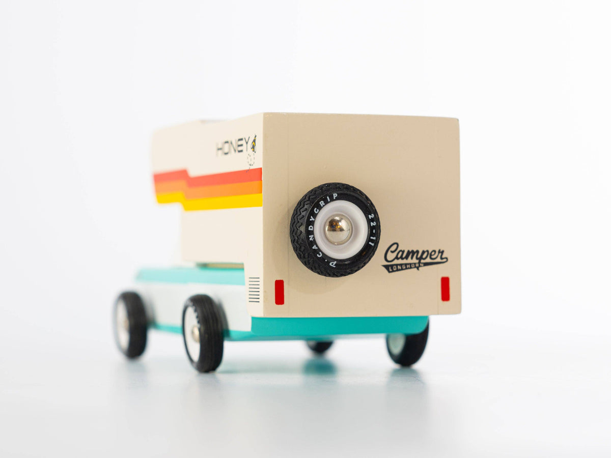 Small model of a camper van with 'Camper' branding on a white background