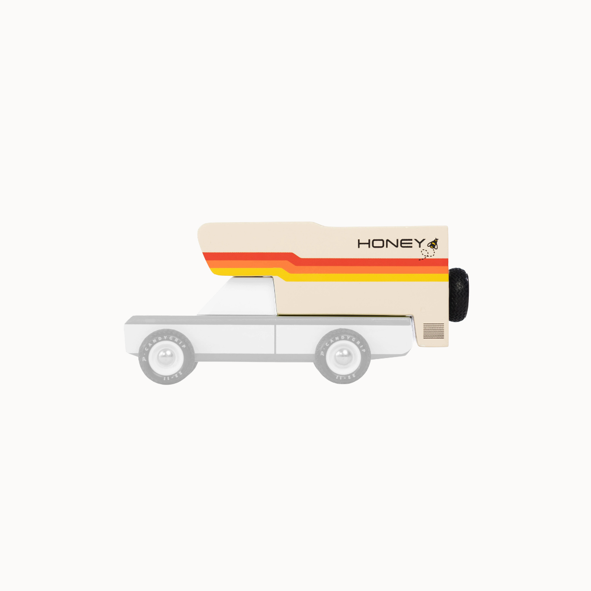 Small model of a camper van with Honeybee branding on a white background