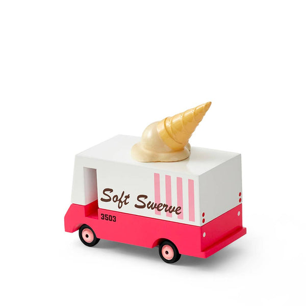 Toy ice cream truck with a soft serve cone on top against a white background