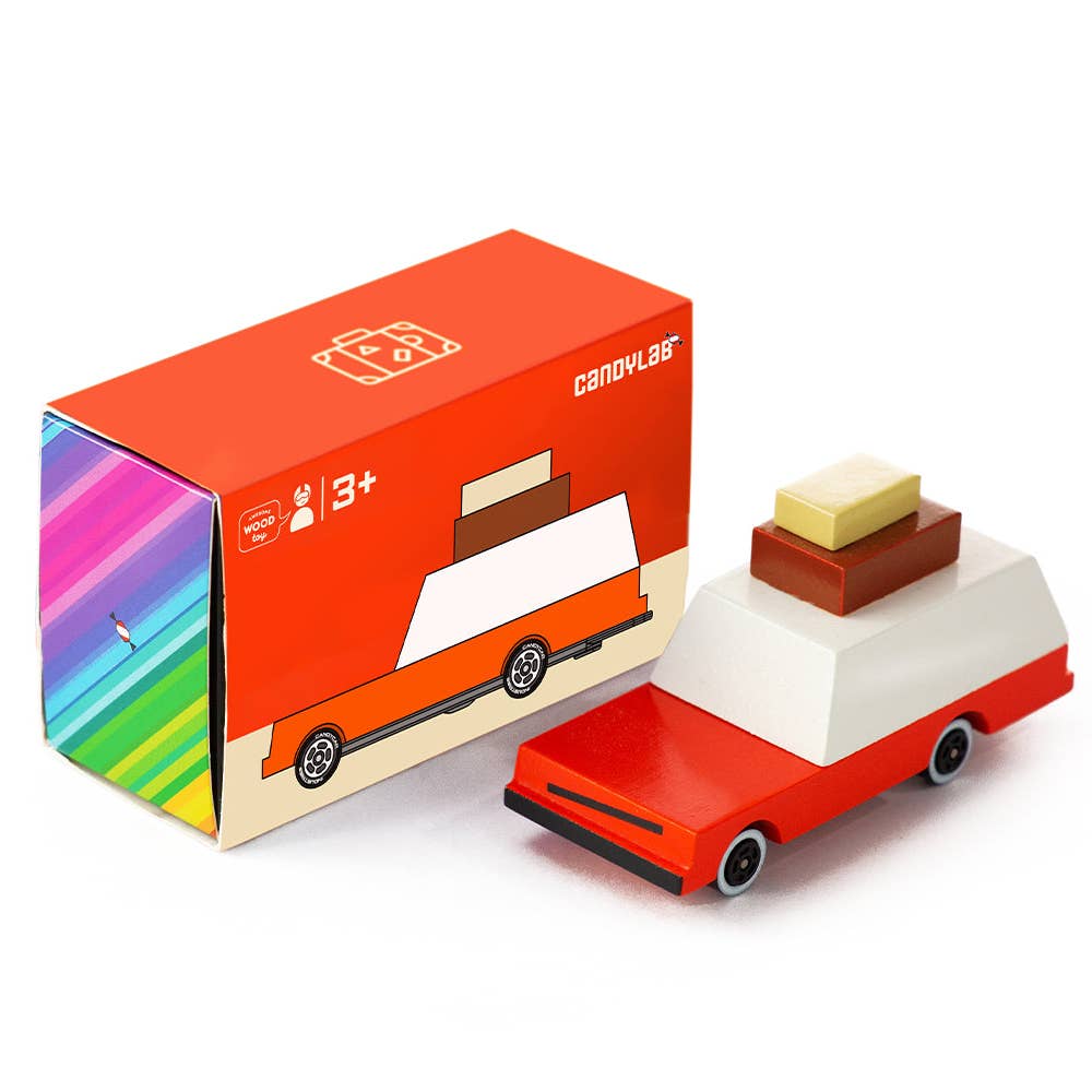 Wooden toy car with a colorful box on a white background