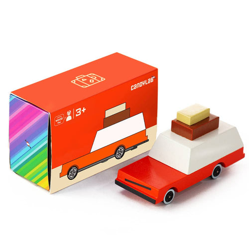 Wooden toy car with a colorful box on a white background
