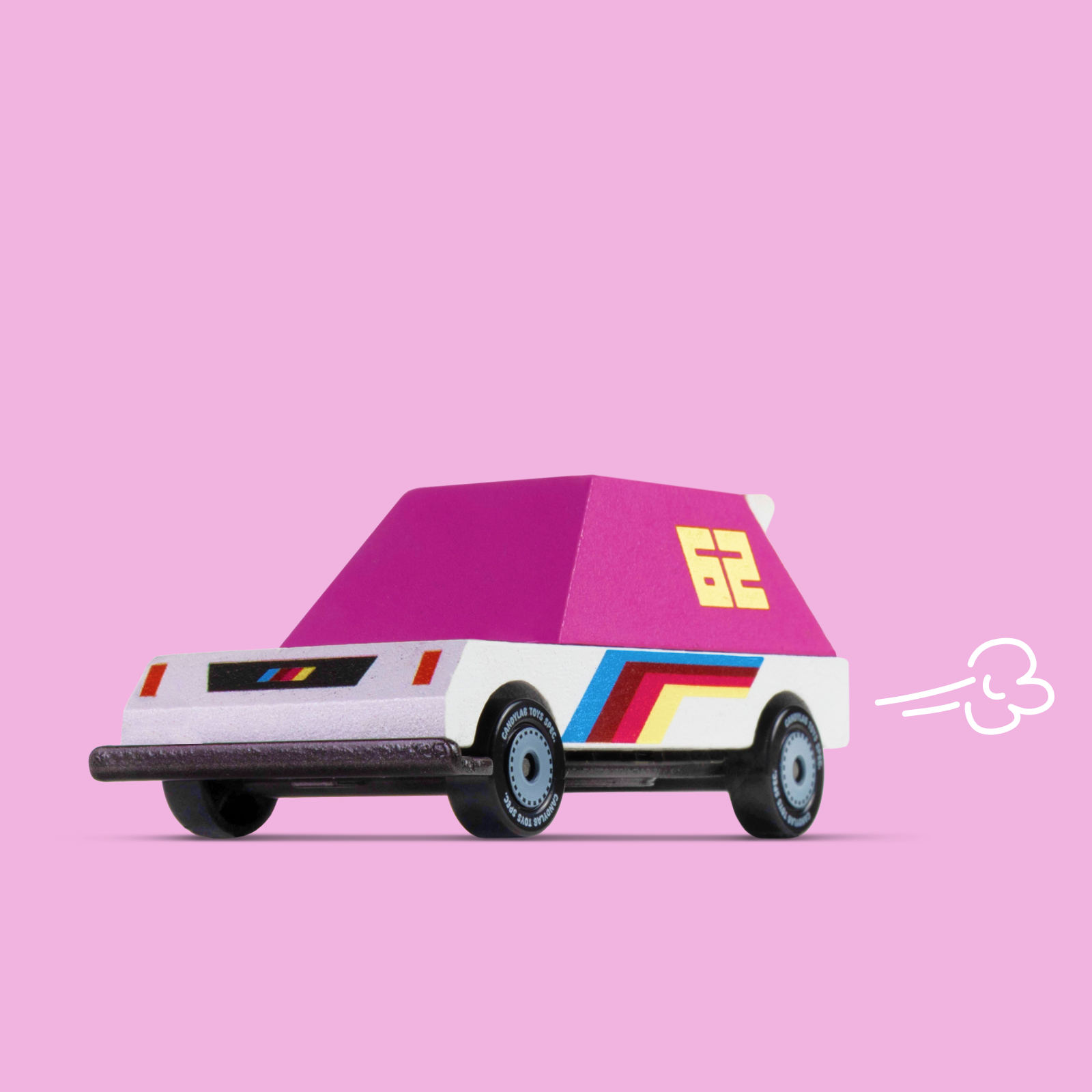Toy car with a pink roof and colorful stripes on a pink background