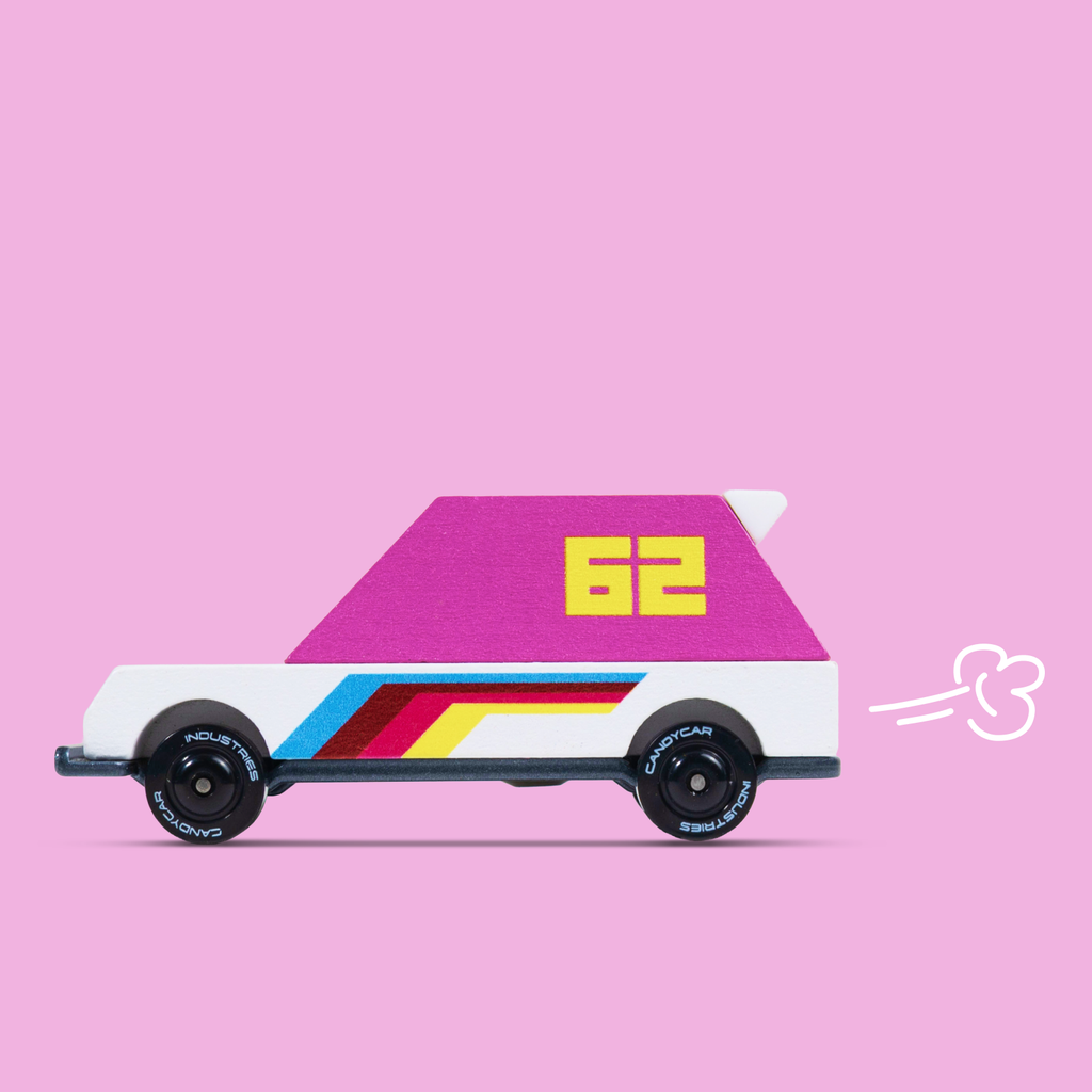 Colorful toy car with a pink top and rainbow stripes on a pink background