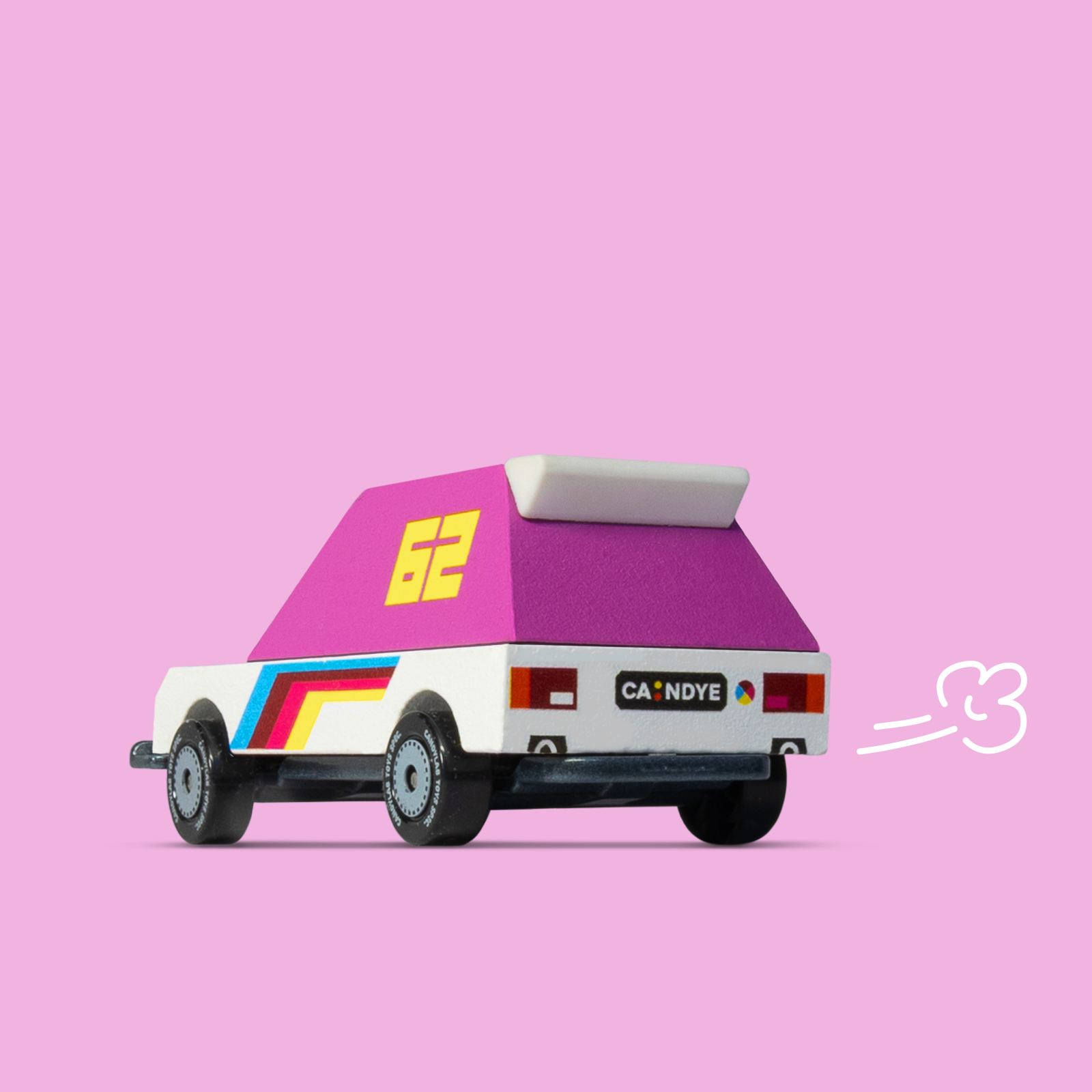 Toy car with a pink roof and colorful design on a pink background