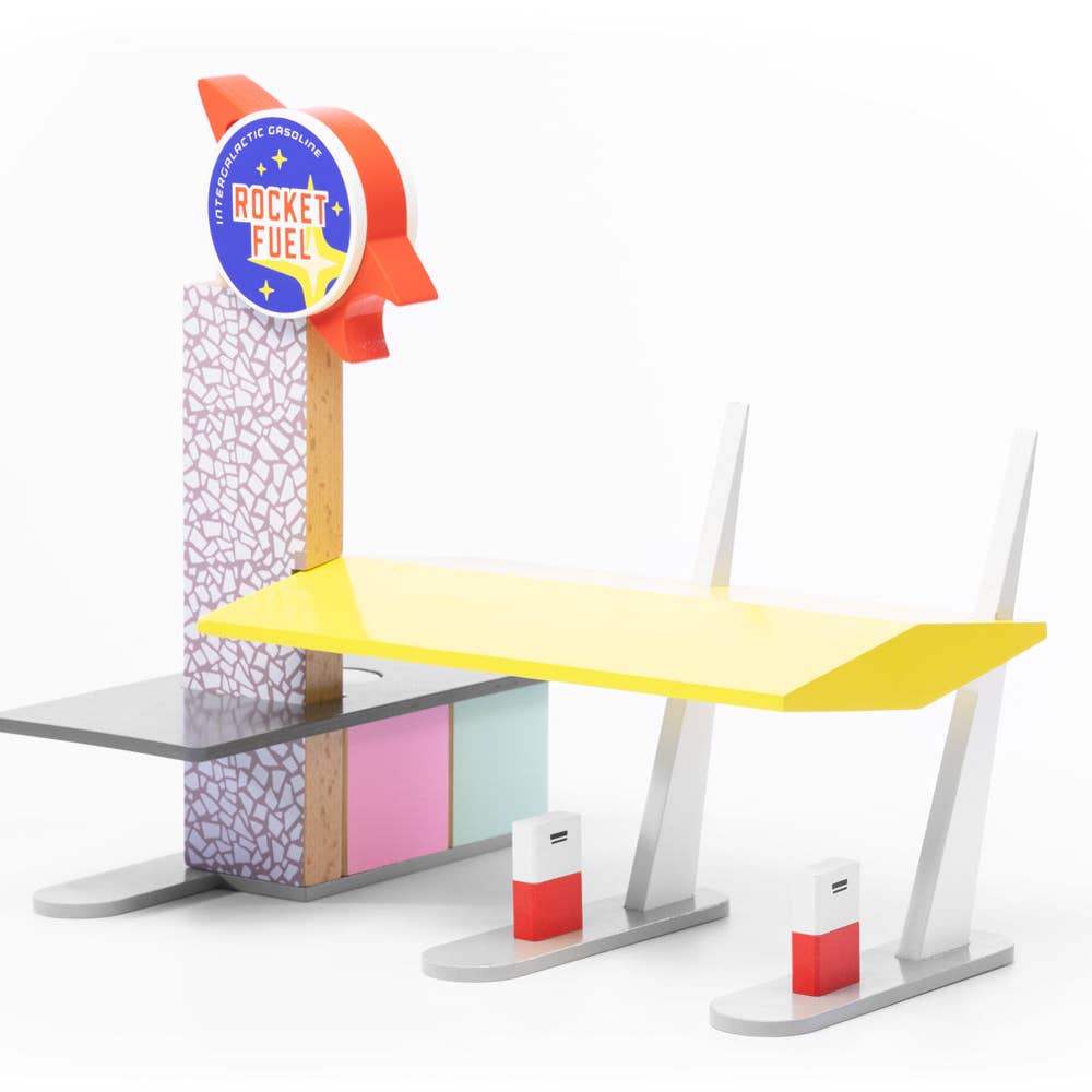 Toy fuel station with a yellow platform and 'Rocket Fuel' sign on a white background
