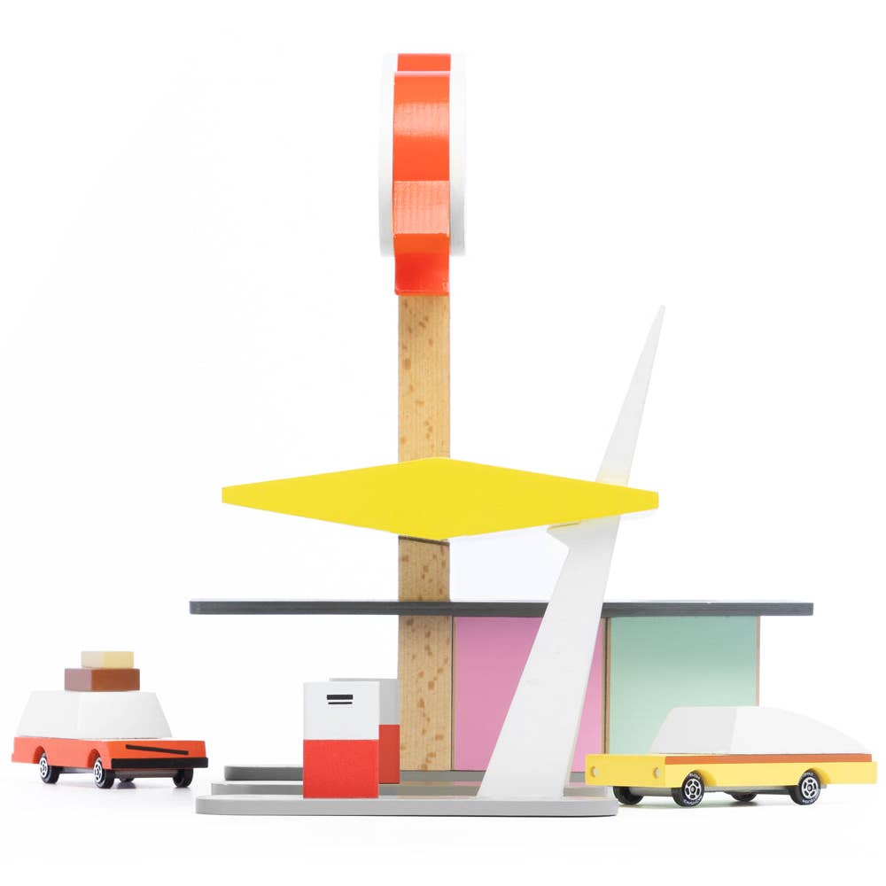 Colorful toy set with a tower and cars on a white background