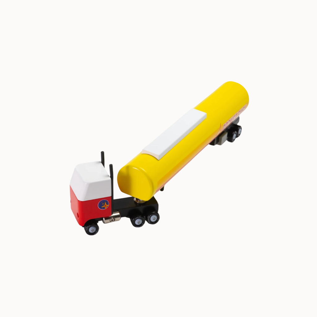 A small toy tanker truck with a yellow cylindrical tanker, a red and white cab, and black wheels, photographed on a plain white background.