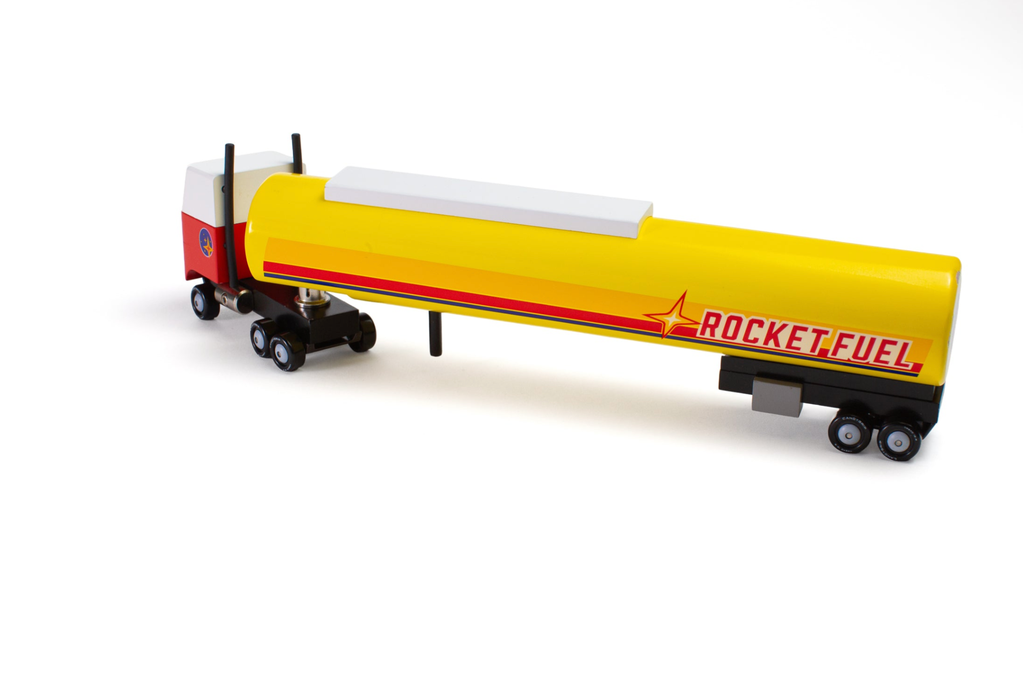 Model of a semi-trailer truck with a yellow tanker car labeled 'Rocket Fuel' on a white background