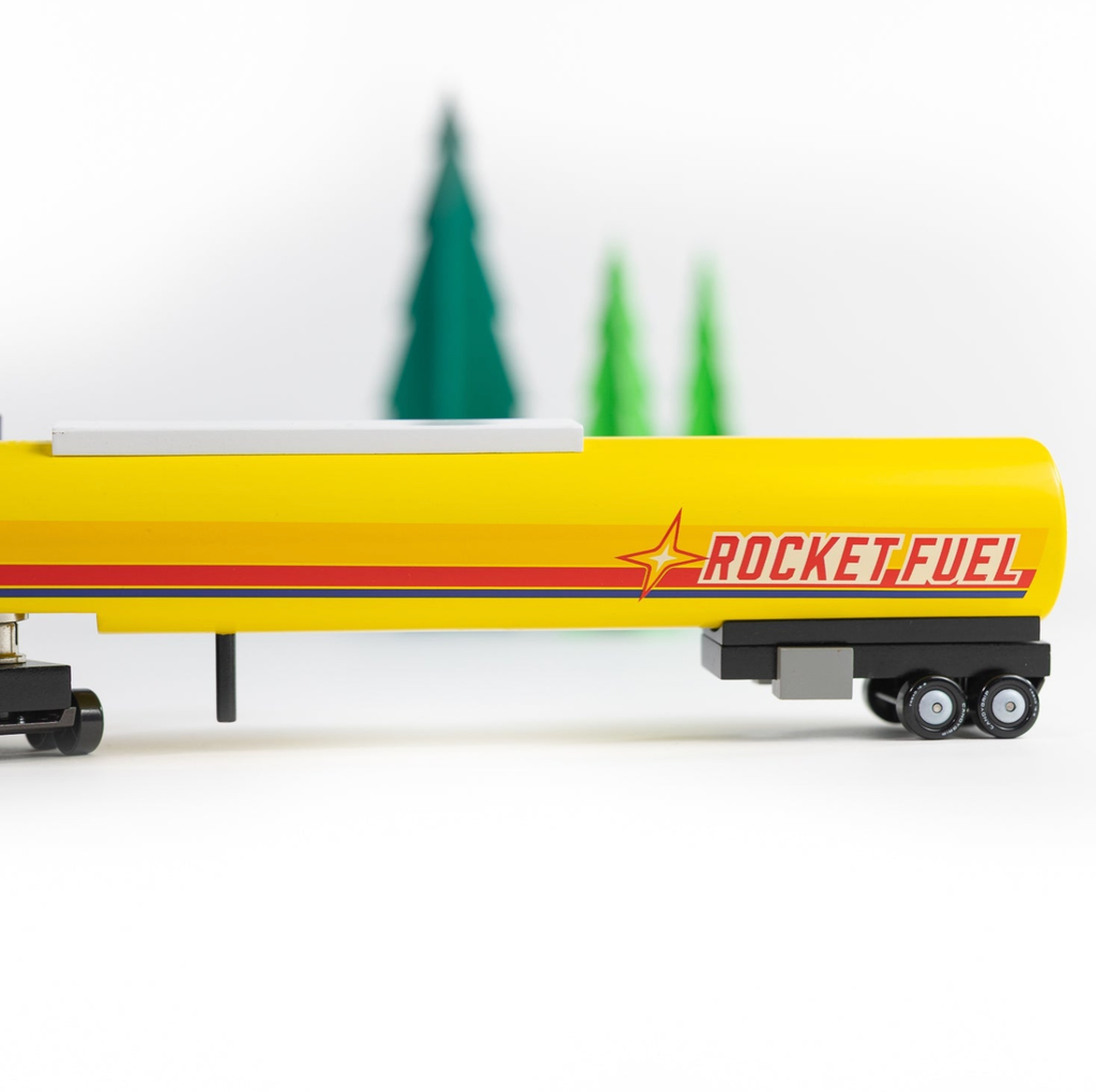 Model of a yellow tanker truck with 'Rocket Fuel' branding on a white background