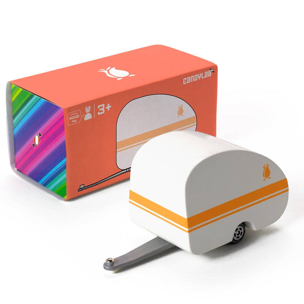 Model of a small trailer with colorful packaging on a white background