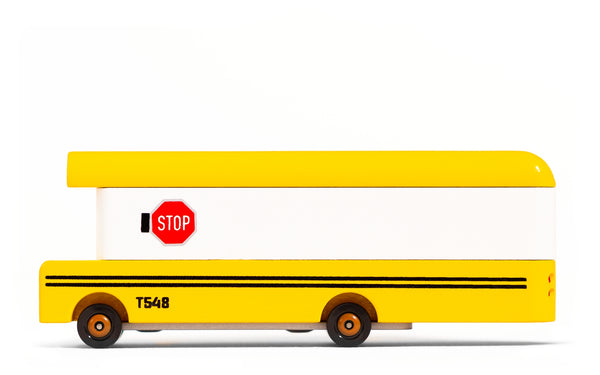 Yellow toy truck with a red stop sign on a white background