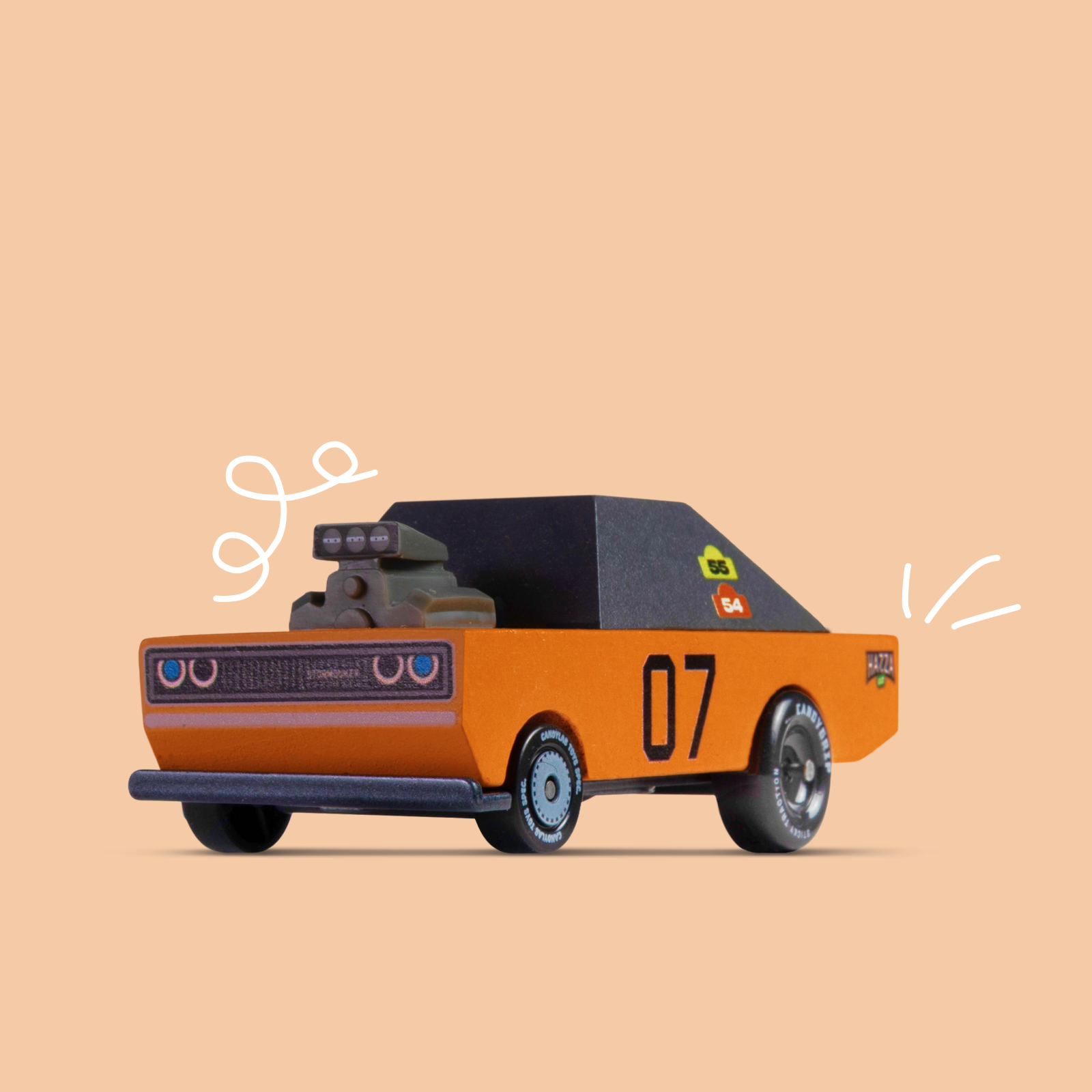 Toy truck with a black roof and orange body on a beige background