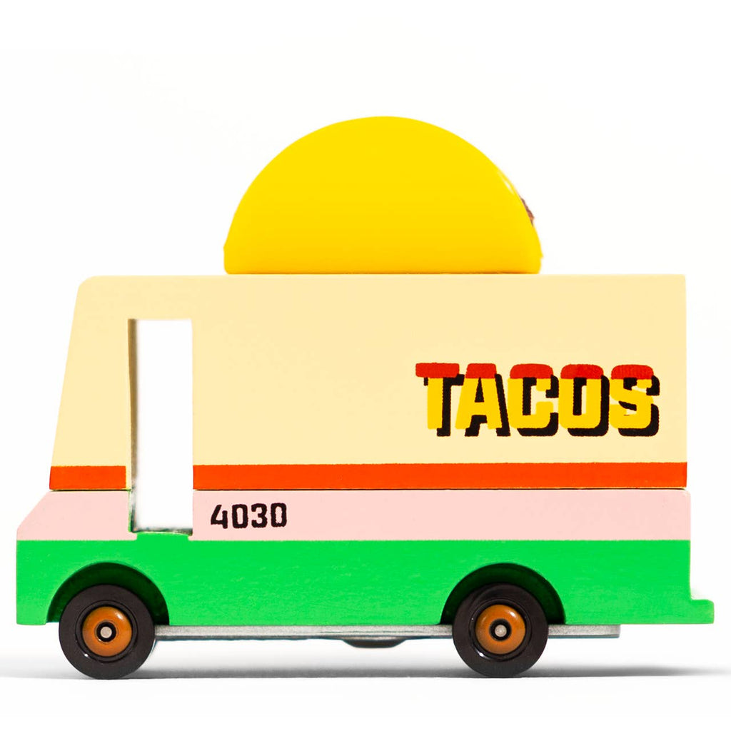 Toy taco truck with a yellow taco on top against a white background