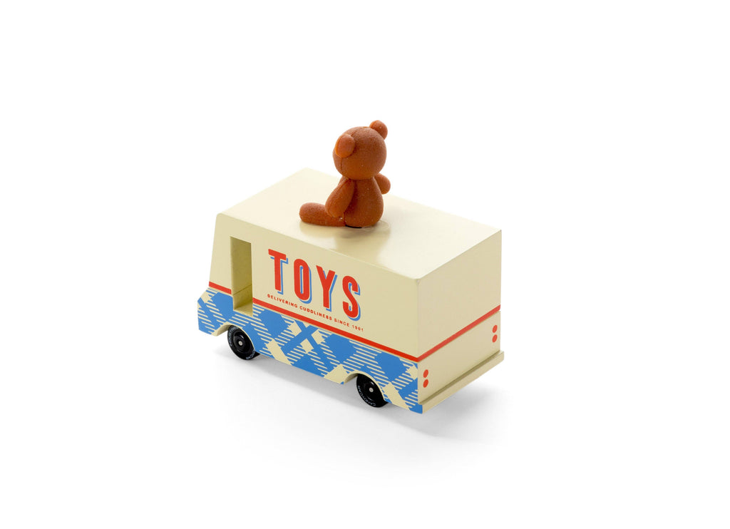 Toy truck with 'TOYS' on the side and a teddy bear on top against a white background