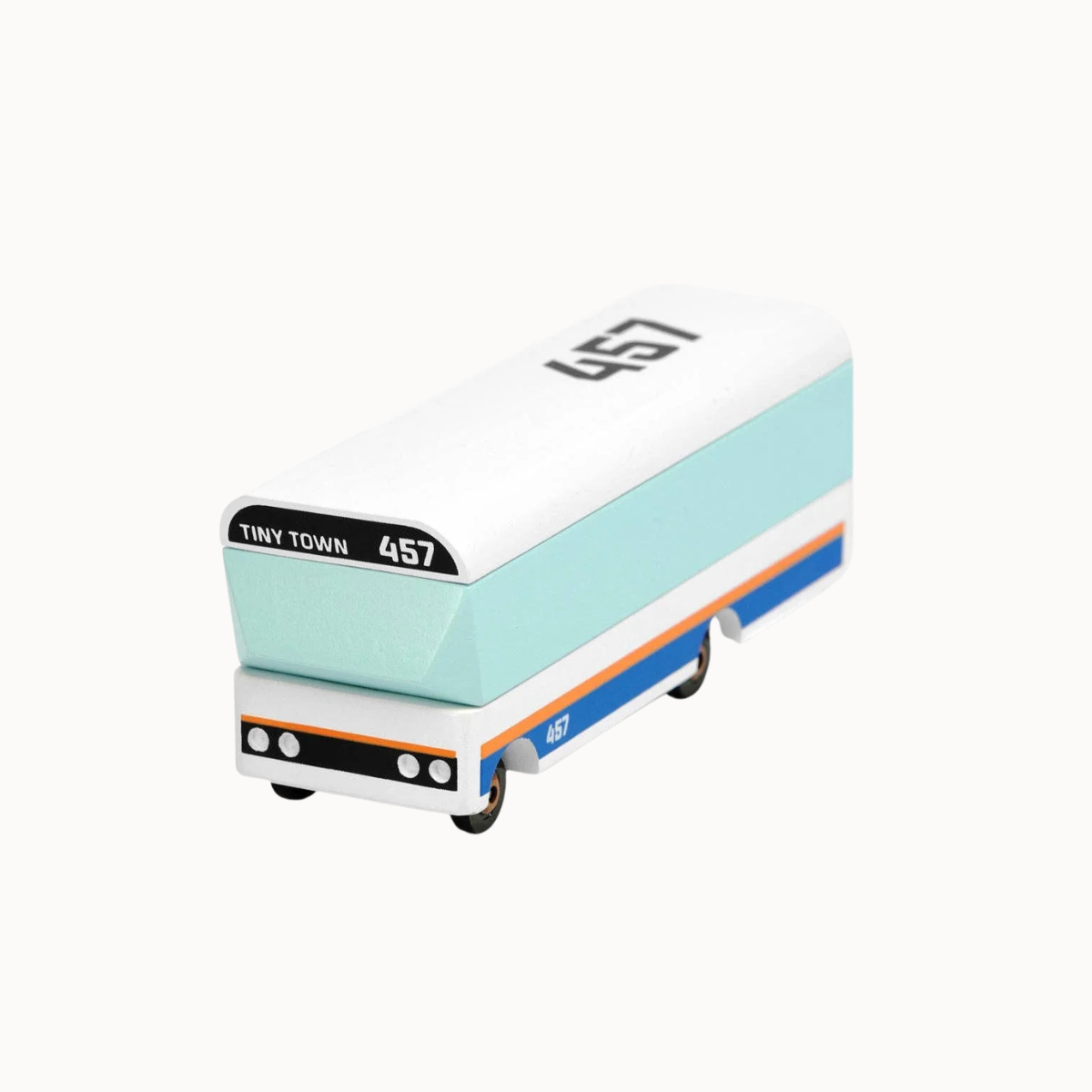 A miniature toy bus model with a white top, light blue middle section, and blue and orange stripes on the lower side, featuring 'TINY TOWN 457' on the front.