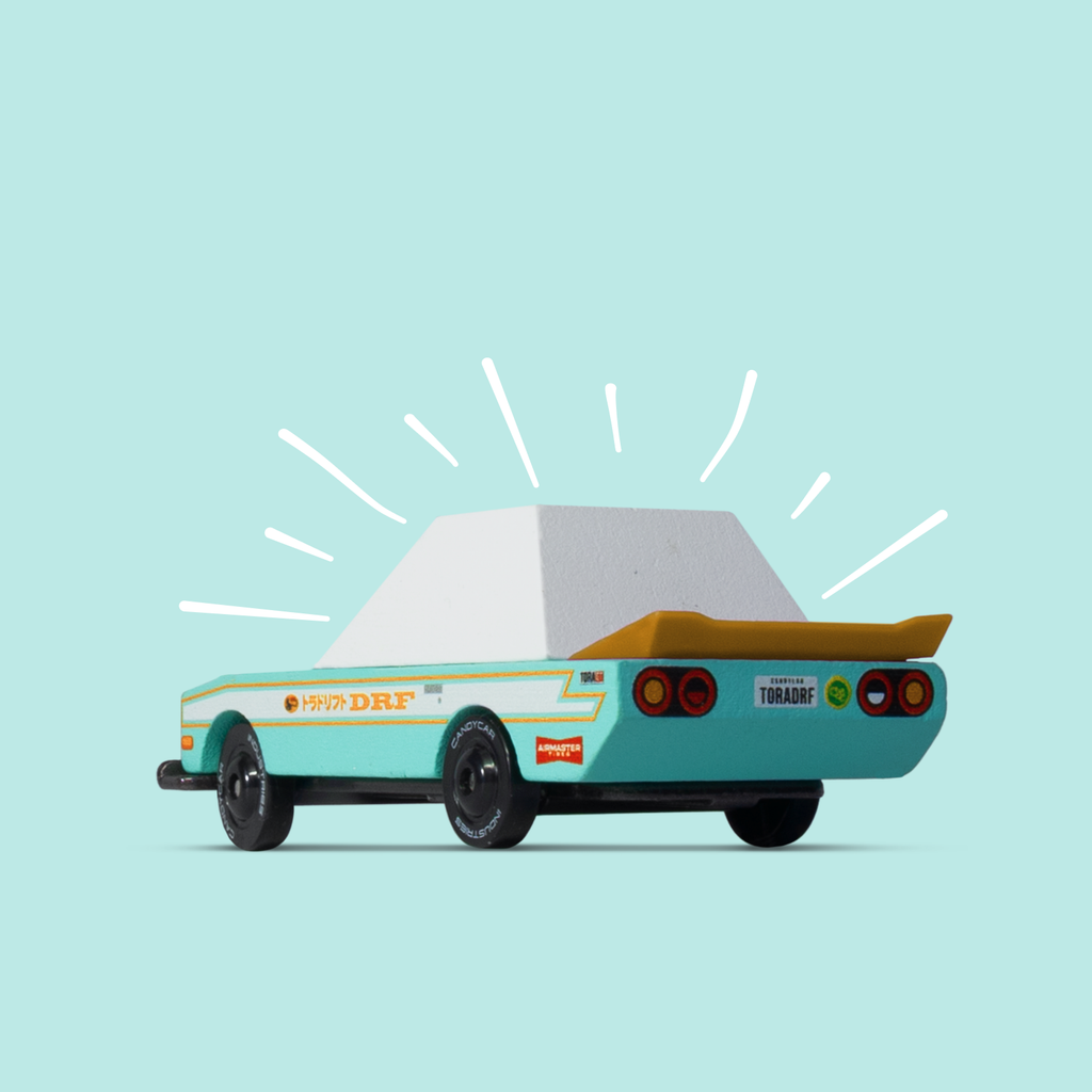 Toy car with a light blue background
