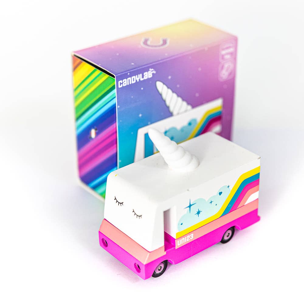 wooden unicorn toy van on white background