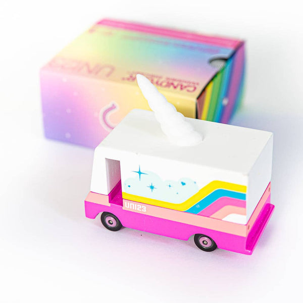 Colorful unicorn shaped truck wooden toy with box on a white background