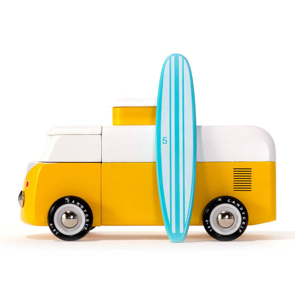 Toy van with a surfboard on a white background