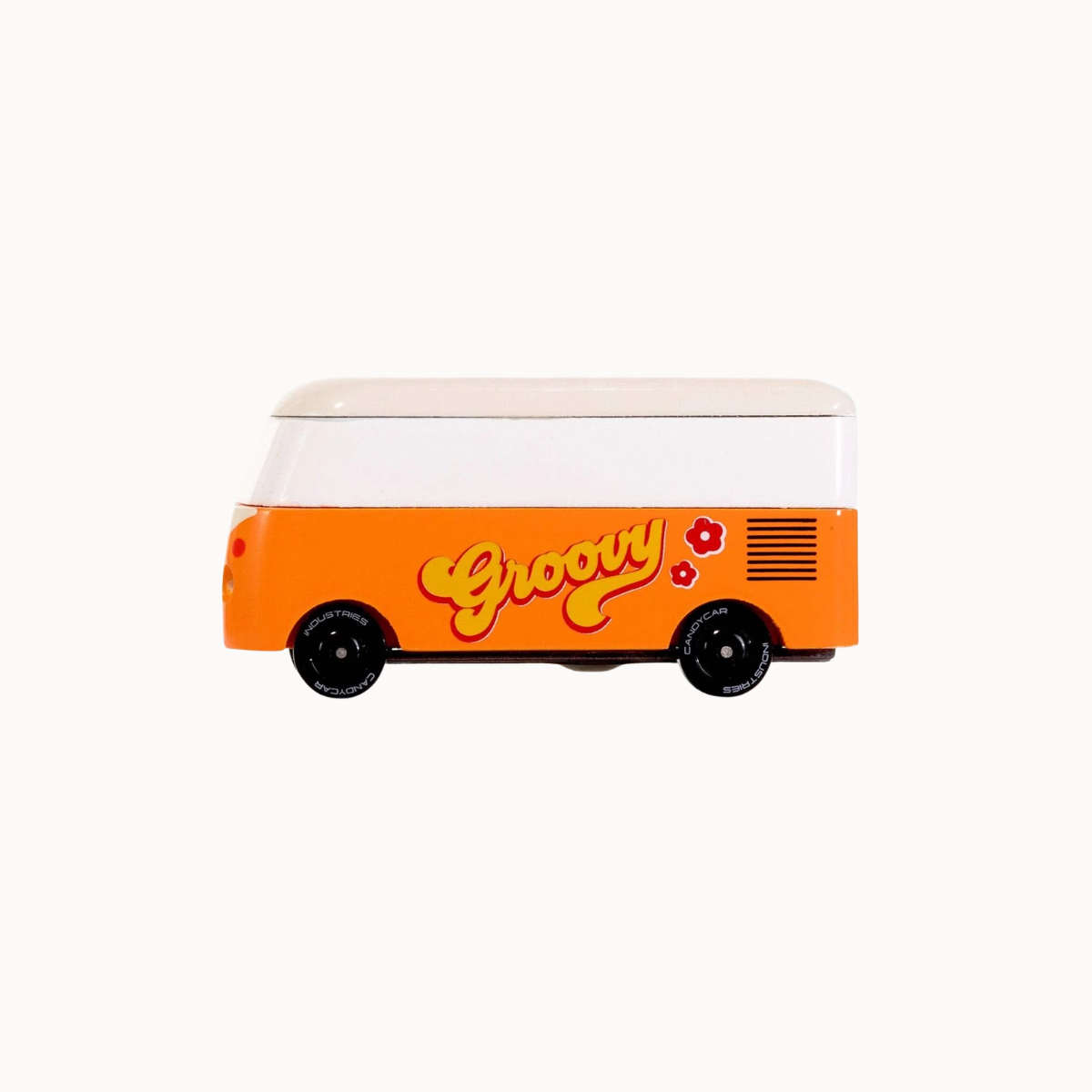 A retro-style toy van with a white upper section and a bright orange lower section, featuring the word 'Groovy' in yellow script with red flowers on the side, set against a plain white background.