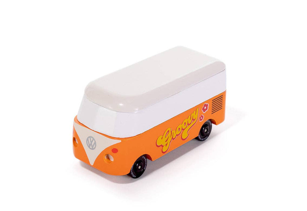 Model of a vintage orange and white bus with 'Groovy' text on a white background