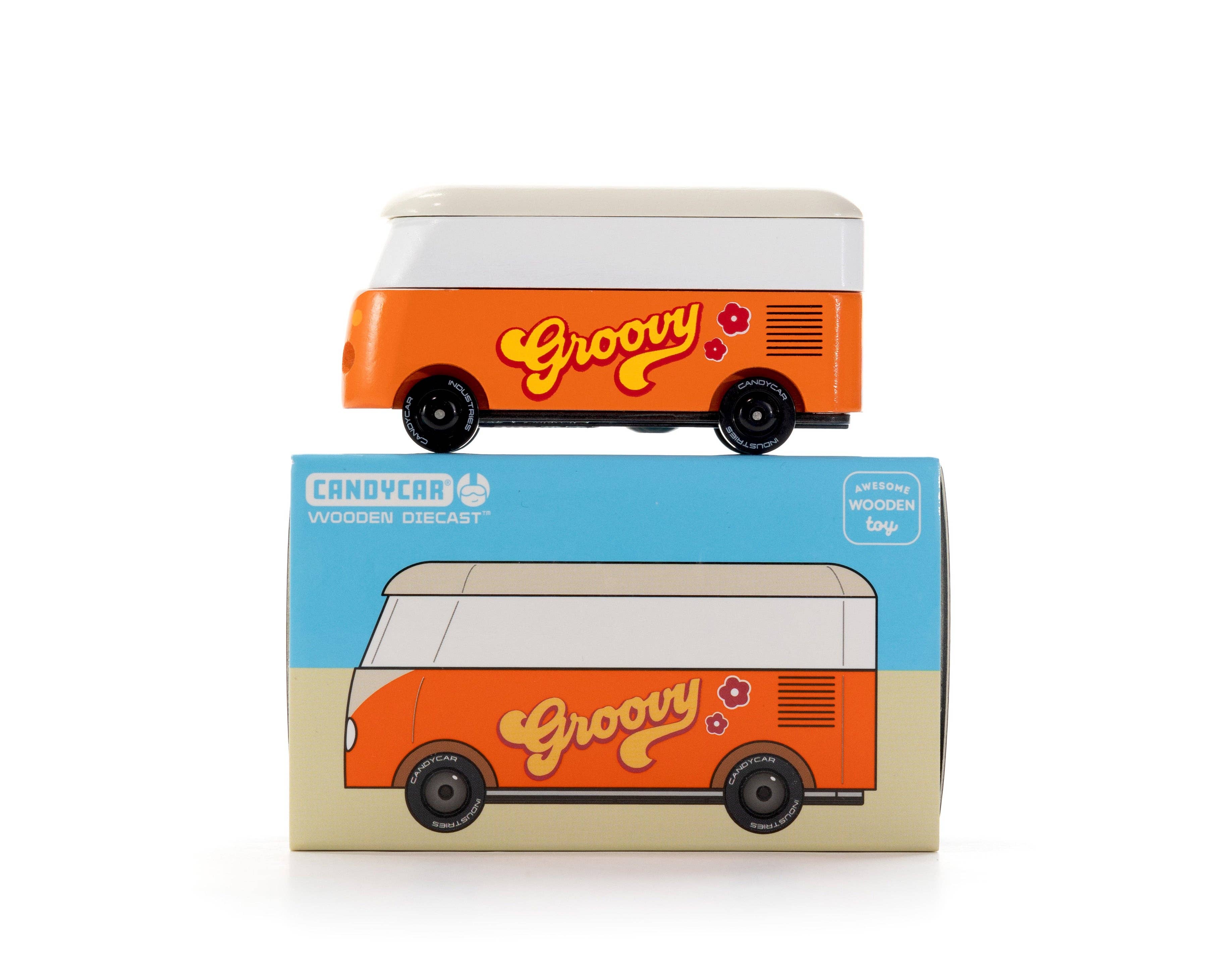 Orange toy van with 'Groovy' text on a blue and beige box