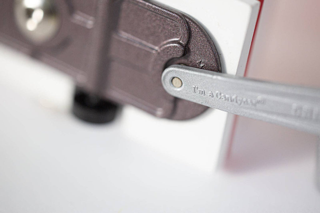 Close-up of a metal bracket with 'I'm a Chaser' branding on a white background