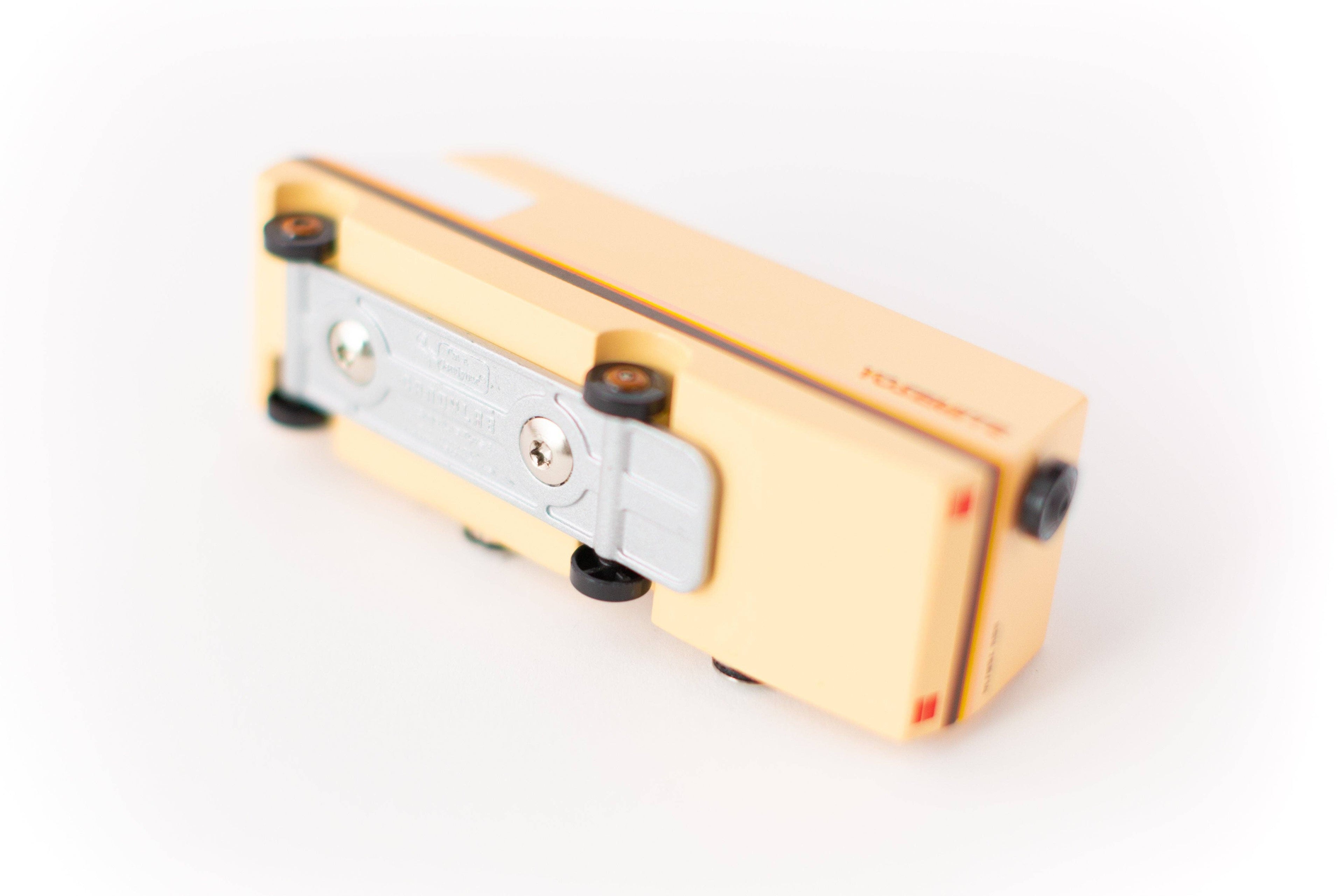 Gold and silver pencil sharpener on a white background