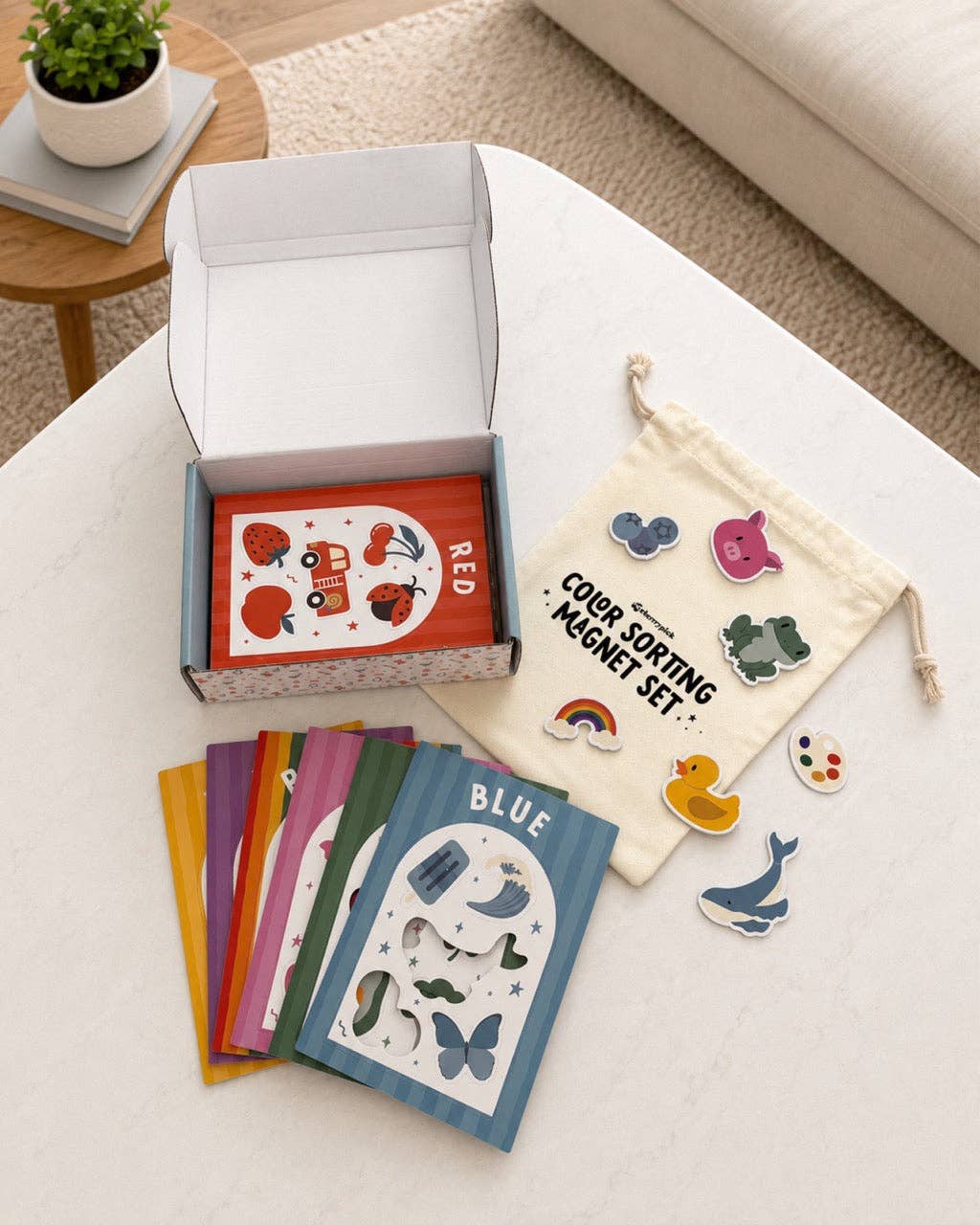 Color sorting magnet set with cards and drawstring bag on a table