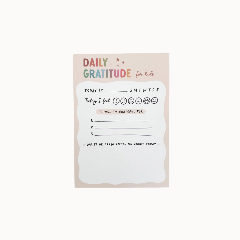 A daily gratitude card for kids with a pastel pink background and a white writing area in the center, featuring prompts like 'Today I feel' and 'Things I'm grateful for'.