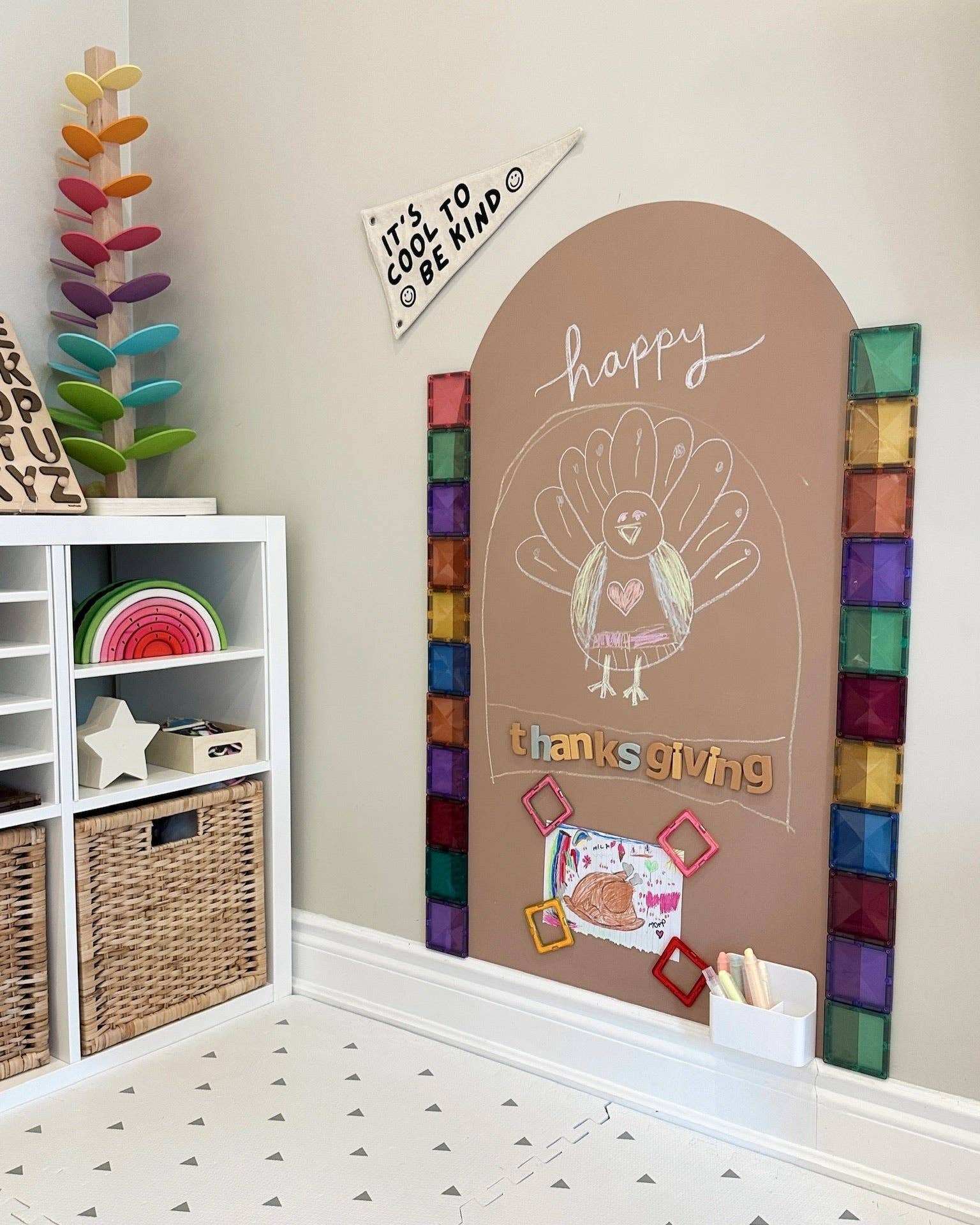 Children's room with a colorful chalkboard wall featuring a turkey drawing and 'Happy Thanksgiving' text.