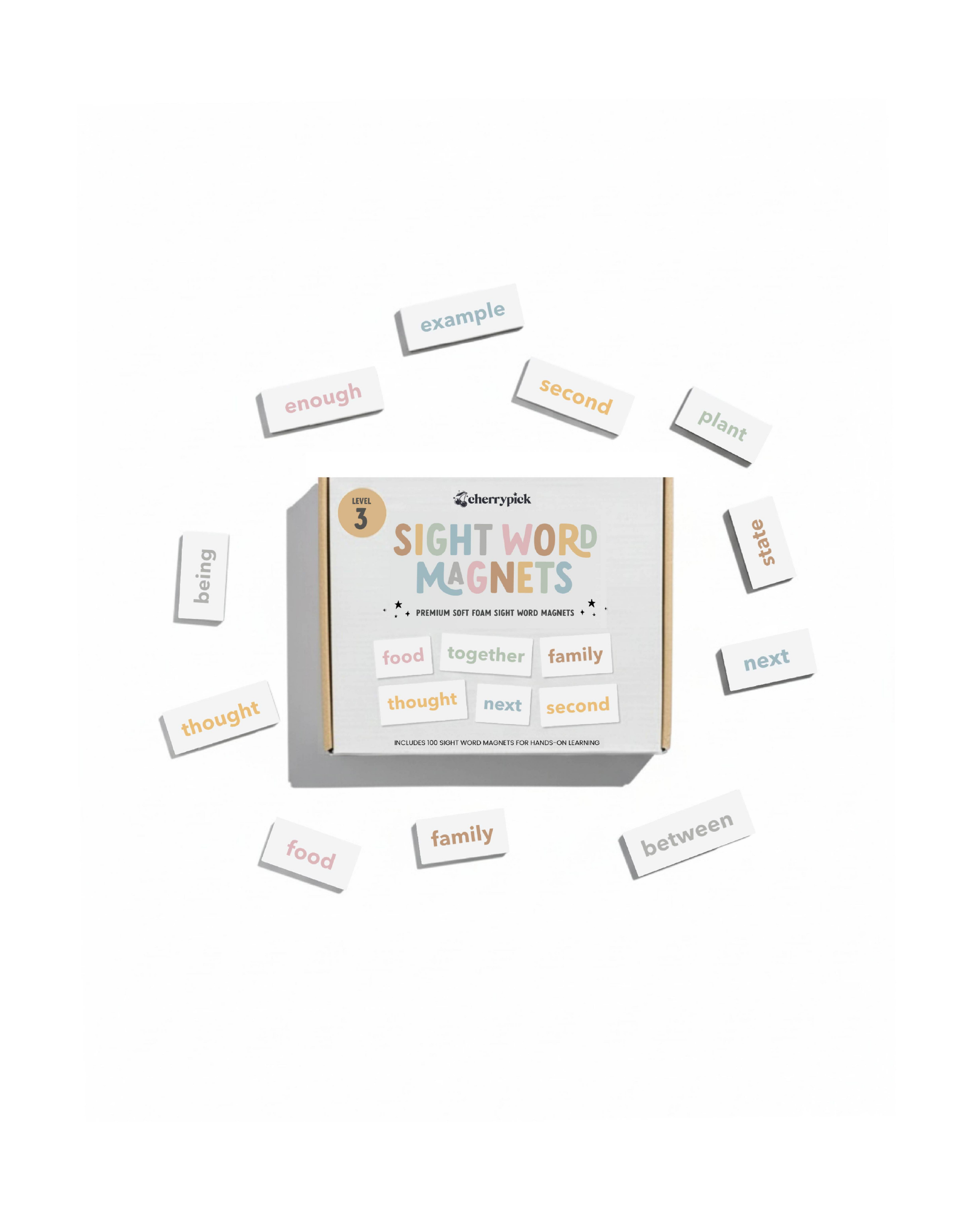 Box of sight word magnets with scattered magnetic letters on a white background