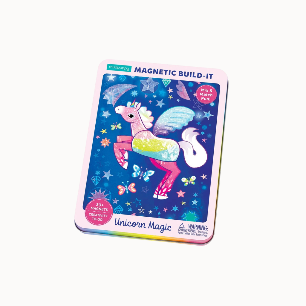 A children's magnetic build-it toy card featuring a colorful unicorn illustration on a dark blue starry background. The card has rounded corners, a pink border, and text reading 'MAGNETIC BUILD-IT' and 'Unicorn Magic,' with age and safety warning details at the bottom.